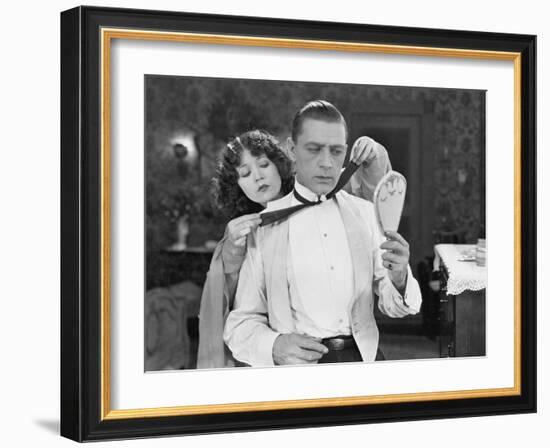 Woman Helping Man Tie Bow Tie-null-Framed Photo