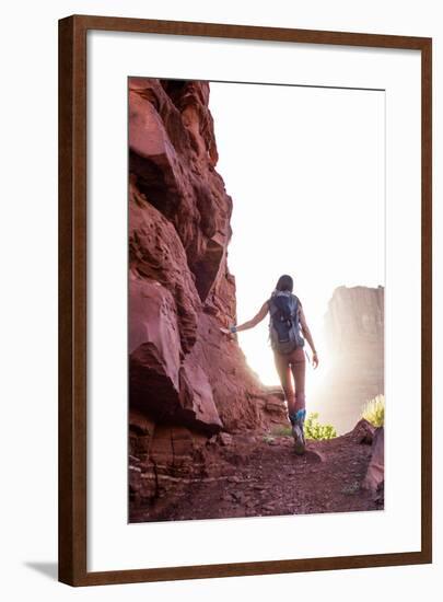 Woman Hikes Towards The Light Of Utah's Red-Rock Desert-Hannah Dewey-Framed Photographic Print