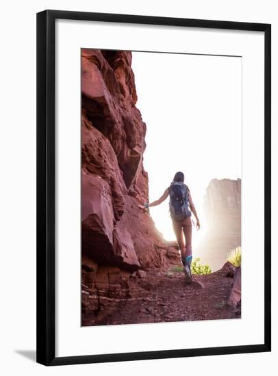 Woman Hikes Towards The Light Of Utah's Red-Rock Desert-Hannah Dewey-Framed Photographic Print