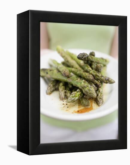 Woman Holding a Plate of Grilled Green Asparagus-null-Framed Premier Image Canvas