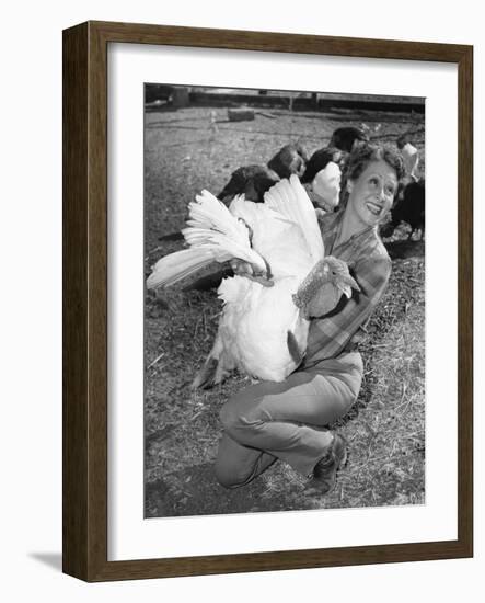 Woman Holding Live Turkey-null-Framed Photo