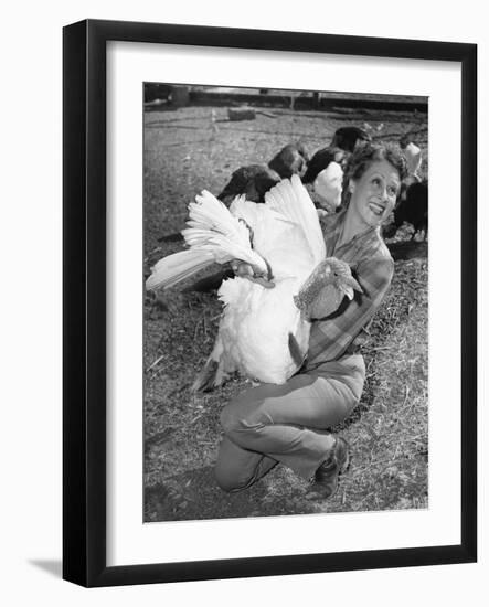 Woman Holding Live Turkey-null-Framed Photo