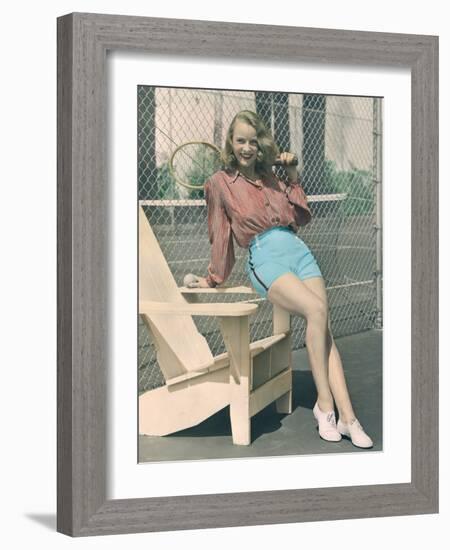 Woman Holding Tennis Racket-null-Framed Photo