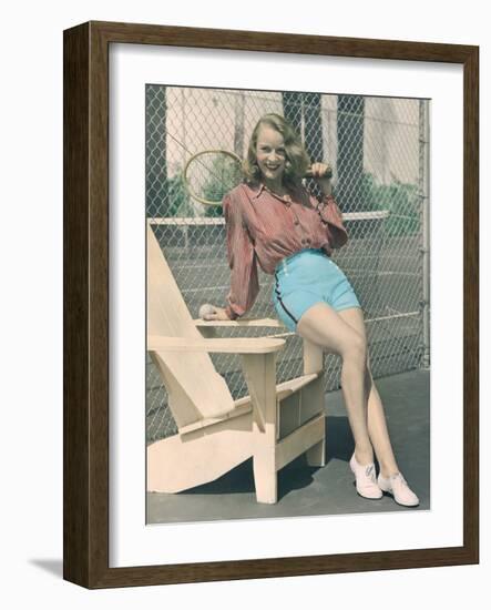 Woman Holding Tennis Racket-null-Framed Photo