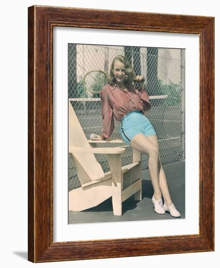 Woman Holding Tennis Racket-null-Framed Photo