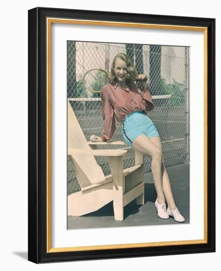 Woman Holding Tennis Racket-null-Framed Photo