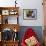 Woman Holds A Freshly Brewed Cup Of Tea In Her Home-Hannah Dewey-Framed Photographic Print displayed on a wall