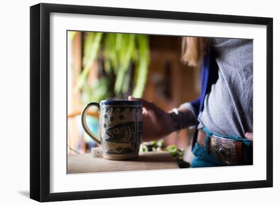 Woman Holds A Freshly Brewed Cup Of Tea In Her Home-Hannah Dewey-Framed Photographic Print