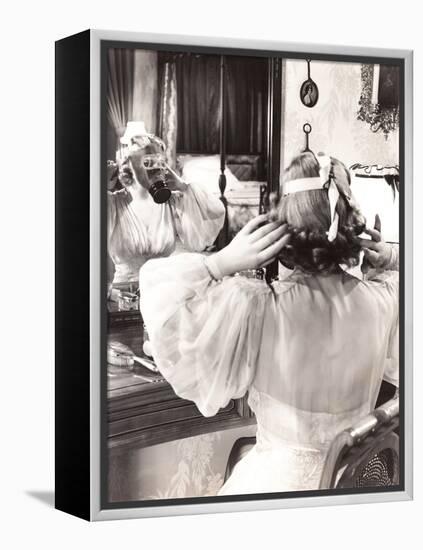 Woman in Gas Mask Looking in Mirror-null-Framed Stretched Canvas