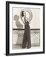 Woman in Jumpsuit Posing by Life Preserver-null-Framed Photo