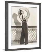 Woman in Jumpsuit Posing by Life Preserver-null-Framed Photo