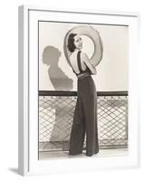 Woman in Jumpsuit Posing by Life Preserver-null-Framed Photo