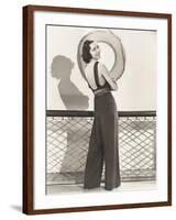 Woman in Jumpsuit Posing by Life Preserver-null-Framed Photo