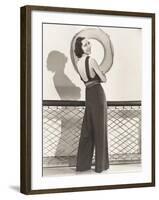 Woman in Jumpsuit Posing by Life Preserver-null-Framed Photo