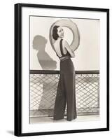 Woman in Jumpsuit Posing by Life Preserver-null-Framed Photo