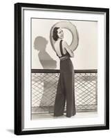 Woman in Jumpsuit Posing by Life Preserver-null-Framed Photo