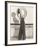 Woman in Jumpsuit Posing by Life Preserver-null-Framed Photo