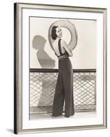 Woman in Jumpsuit Posing by Life Preserver-null-Framed Photo