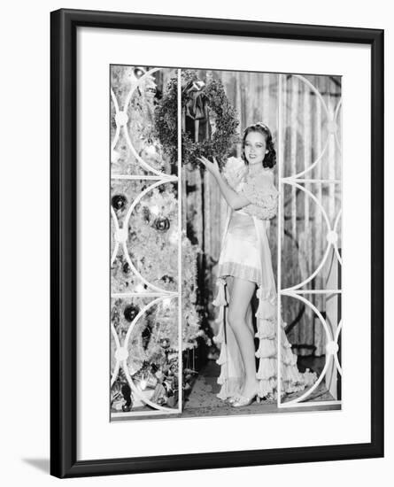 Woman in Lingerie Holding a Christmas Wreath-null-Framed Photo