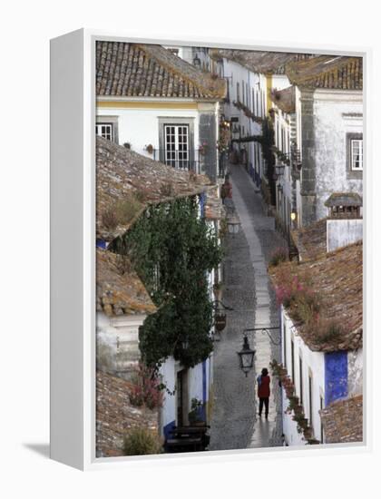 Woman in Narrow Alley with Whitewashed Houses, Obidos, Portugal-Merrill Images-Framed Premier Image Canvas