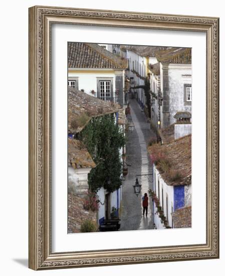 Woman in Narrow Alley with Whitewashed Houses, Obidos, Portugal-Merrill Images-Framed Photographic Print