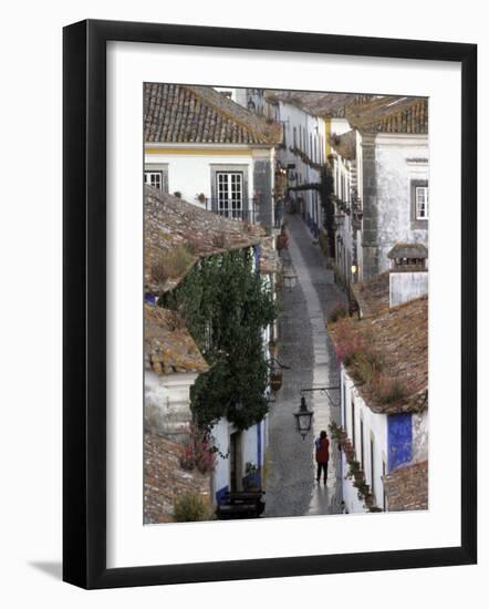 Woman in Narrow Alley with Whitewashed Houses, Obidos, Portugal-Merrill Images-Framed Photographic Print