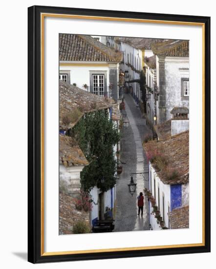 Woman in Narrow Alley with Whitewashed Houses, Obidos, Portugal-Merrill Images-Framed Photographic Print