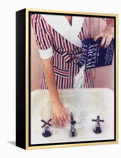 Woman in Red, White and Blue Robe Pouring Ivory Soap Flakes Into Bathroom Sink-Gjon Mili-Framed Premier Image Canvas