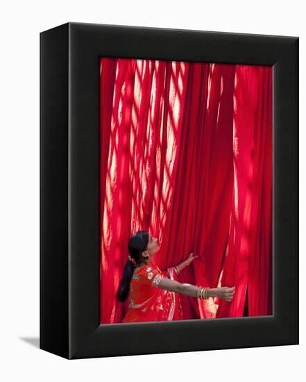 Woman in Sari Checking the Quality of Freshly Dyed Fabric Hanging to Dry, Sari Garment Factory, Raj-Gavin Hellier-Framed Premier Image Canvas