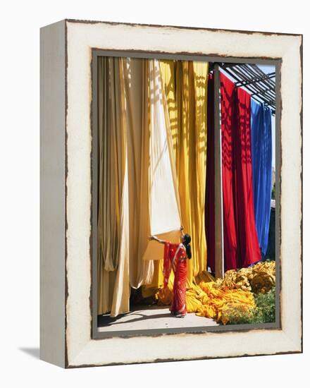 Woman in Sari Checking the Quality of Freshly Dyed Fabric Hanging to Dry, Sari Garment Factory, Raj-Gavin Hellier-Framed Premier Image Canvas