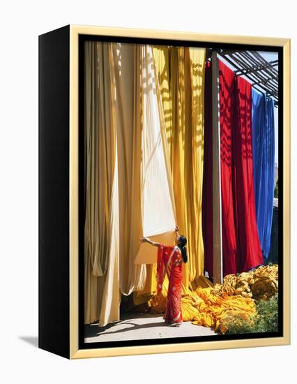 Woman in Sari Checking the Quality of Freshly Dyed Fabric Hanging to Dry, Sari Garment Factory, Raj-Gavin Hellier-Framed Premier Image Canvas