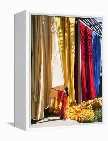 Woman in Sari Checking the Quality of Freshly Dyed Fabric Hanging to Dry, Sari Garment Factory, Raj-Gavin Hellier-Framed Premier Image Canvas