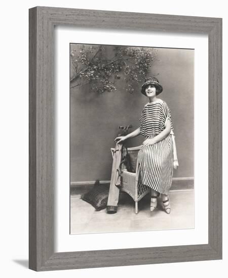 Woman in Striped Dress with Golf Clubs-null-Framed Photo