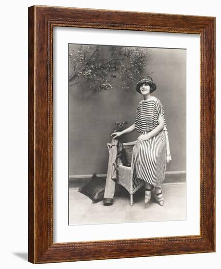 Woman in Striped Dress with Golf Clubs-null-Framed Photo