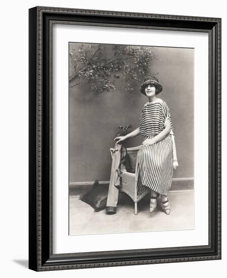Woman in Striped Dress with Golf Clubs-null-Framed Photo