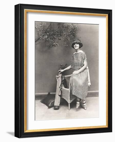 Woman in Striped Dress with Golf Clubs-null-Framed Photo