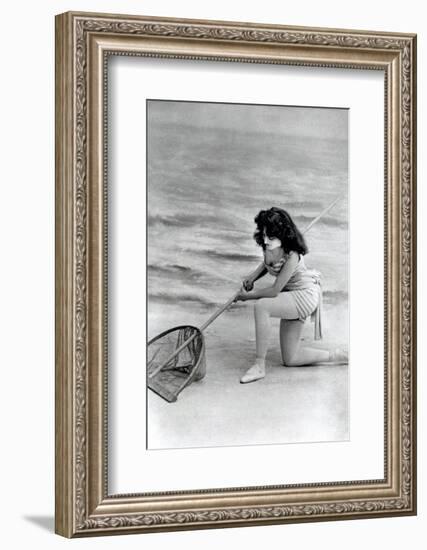 Woman in swimsuit with fishing net-French School-Framed Photographic Print