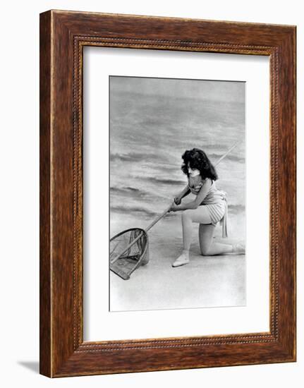 Woman in swimsuit with fishing net-French School-Framed Photographic Print