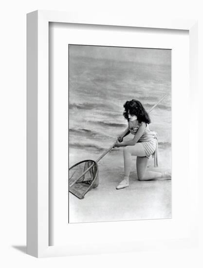 Woman in swimsuit with fishing net-French School-Framed Photographic Print