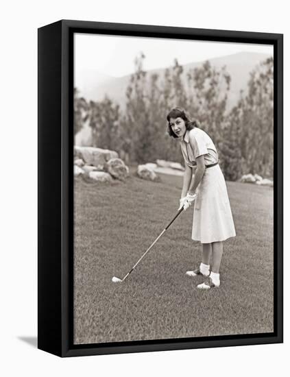 Woman in White Gloves Playing Golf-null-Framed Stretched Canvas