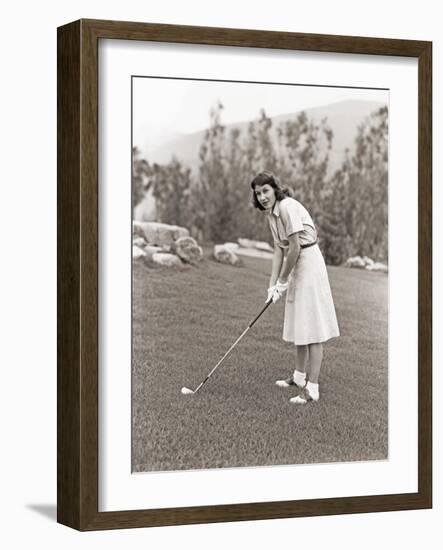 Woman in White Gloves Playing Golf-null-Framed Photo