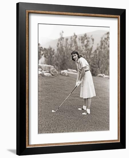 Woman in White Gloves Playing Golf-null-Framed Photo