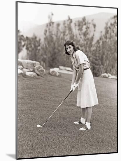 Woman in White Gloves Playing Golf-null-Mounted Photo
