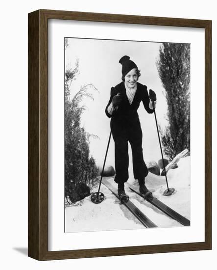 Woman in Winter Clothing Skiing-null-Framed Photo