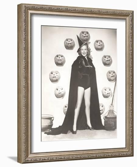 Woman in Witch Costume Surrounded by Carved Pumpkins-null-Framed Photo