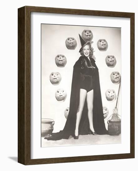 Woman in Witch Costume Surrounded by Carved Pumpkins-null-Framed Photo