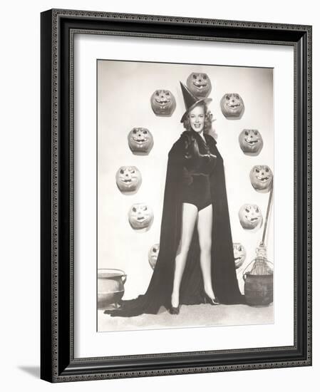 Woman in Witch Costume Surrounded by Carved Pumpkins-null-Framed Photo