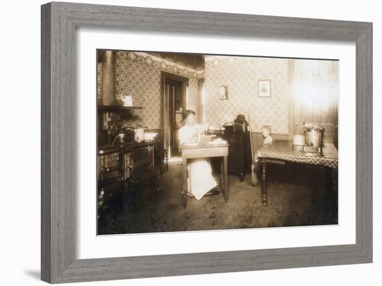 Woman Inserting Bristles into Tooth Brushes in Her Kitchen, C.1912-Lewis Wickes Hine-Framed Photographic Print