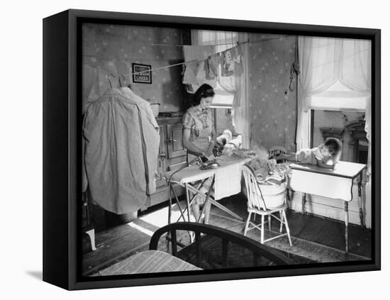 Woman Ironing in Slum Home-William C^ Shrout-Framed Premier Image Canvas