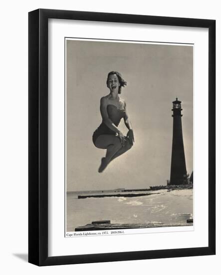 Woman Jumping in Front of Cape Florida Lighthouse, C.1975-null-Framed Giclee Print